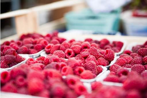Raspberry fruits in tubs