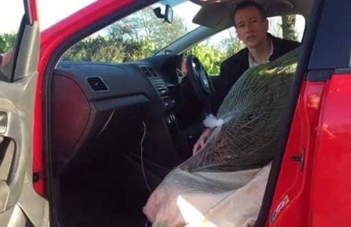 Christmas tree in footwell of car