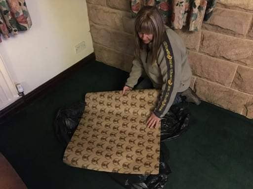 Laying protective paper in lounge